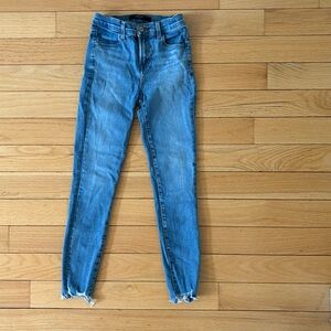 J Brand light blue wash skinny denim size 24. Frayed cut out at the ankle.